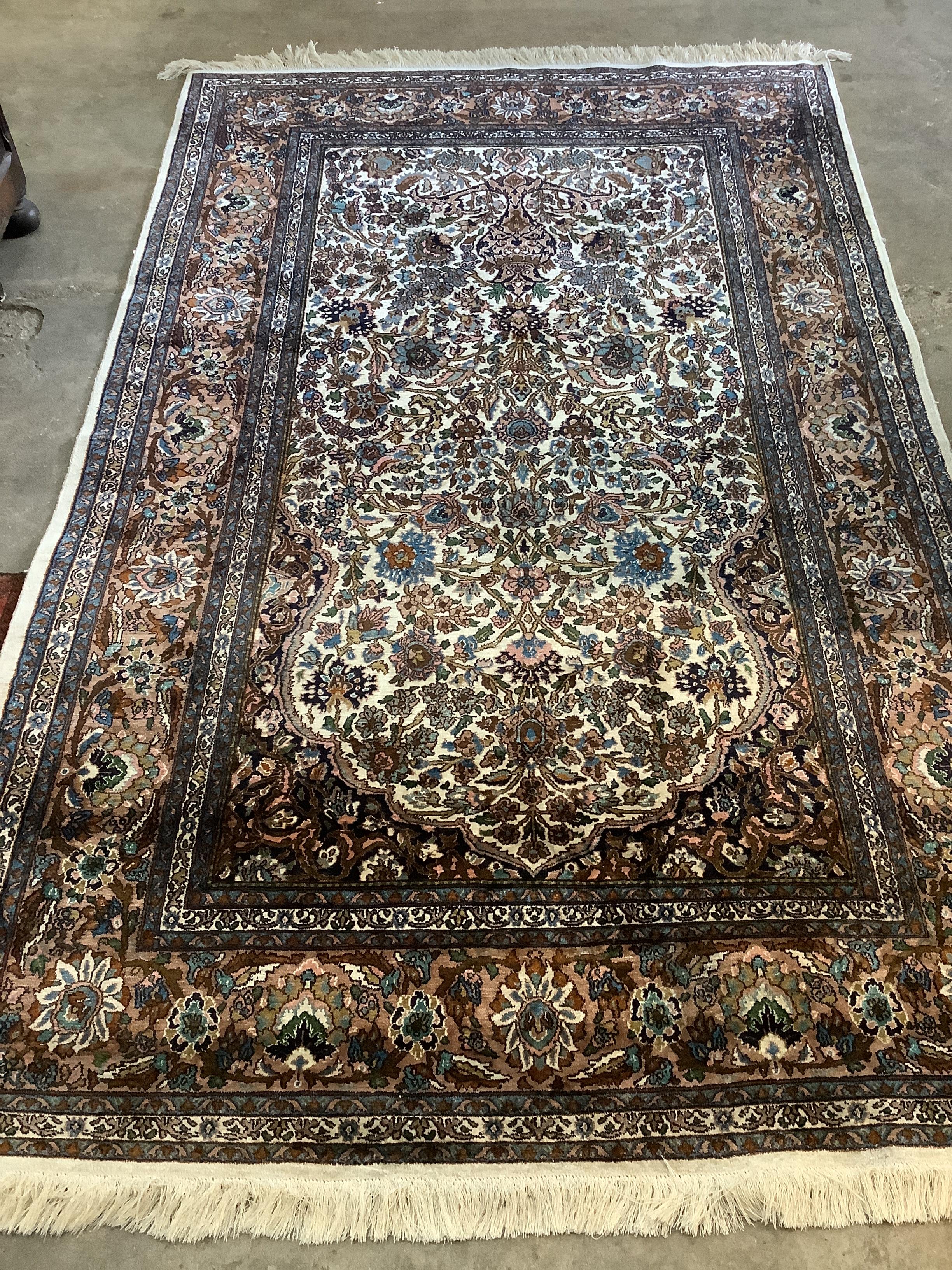 A North West Persian ivory ground rug, 220 x 136cm